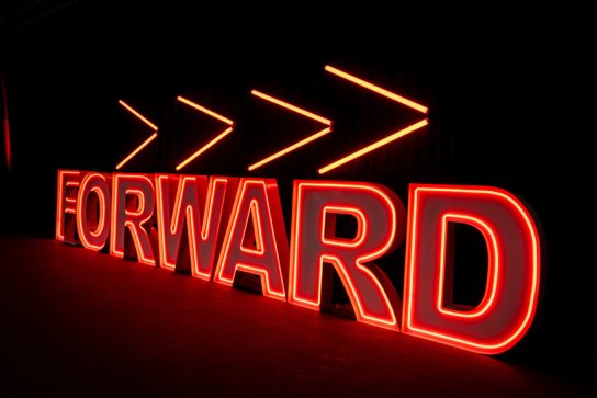 Large standing light up letters spelling FORWARD