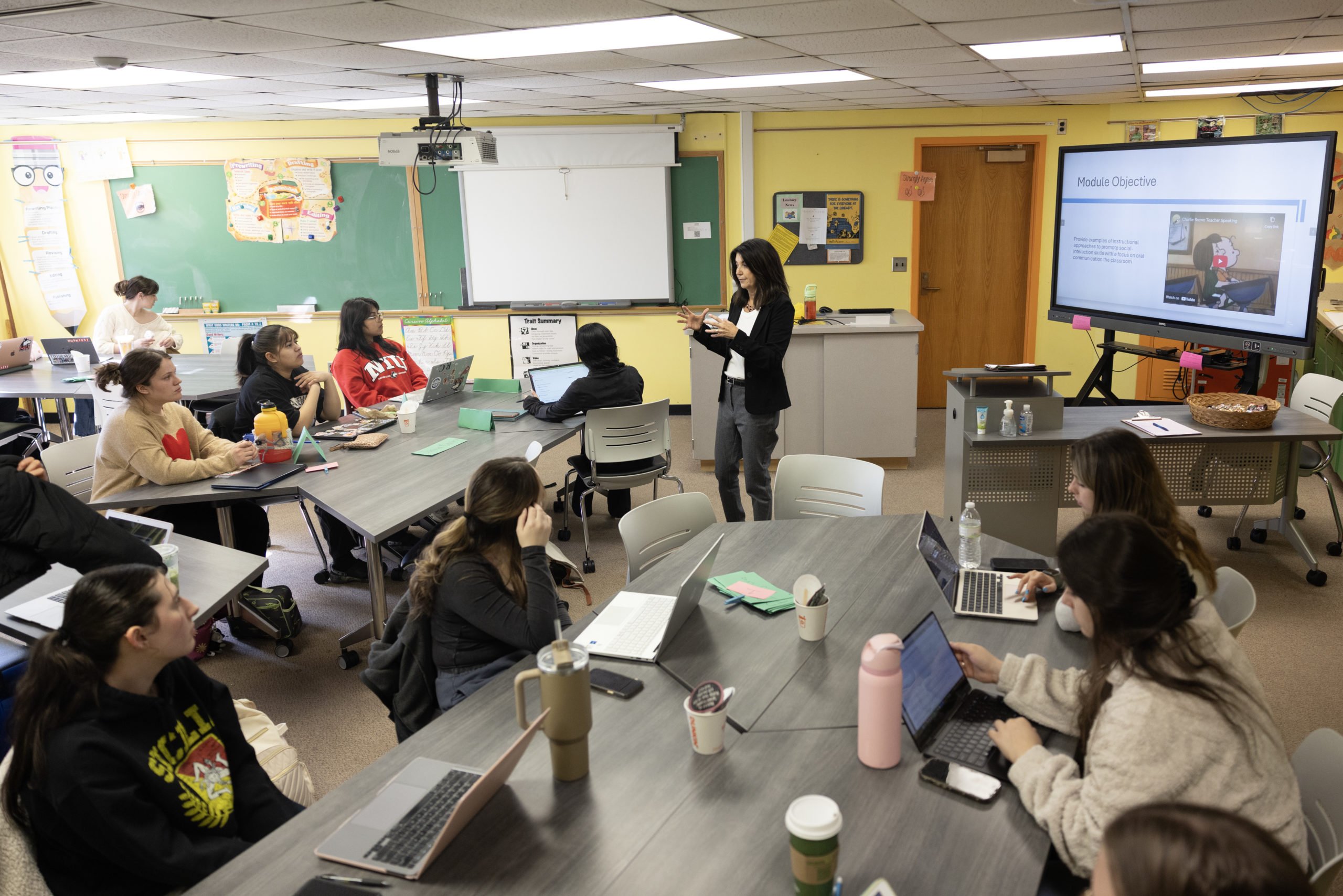 Donna Werderich standing in front of a classroom teaching.